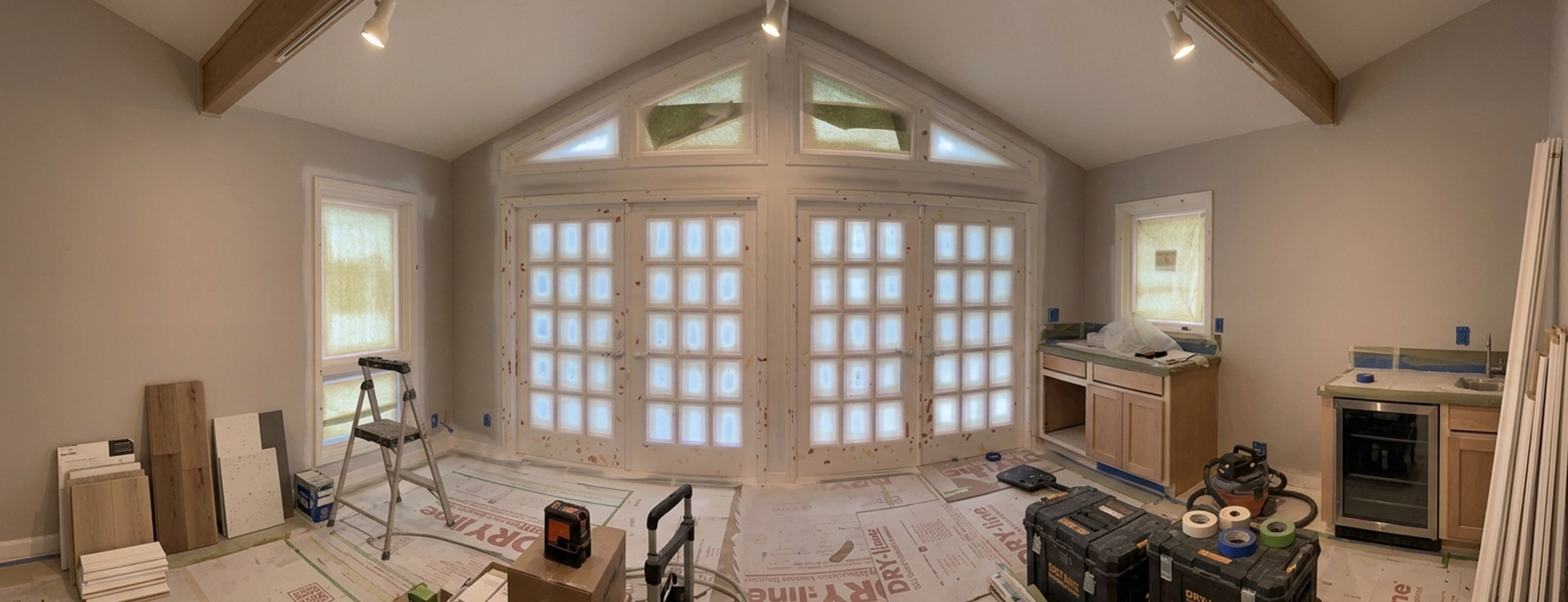 Spacious Room Under Renovation by Painting Contractors with Equipment and Supplies