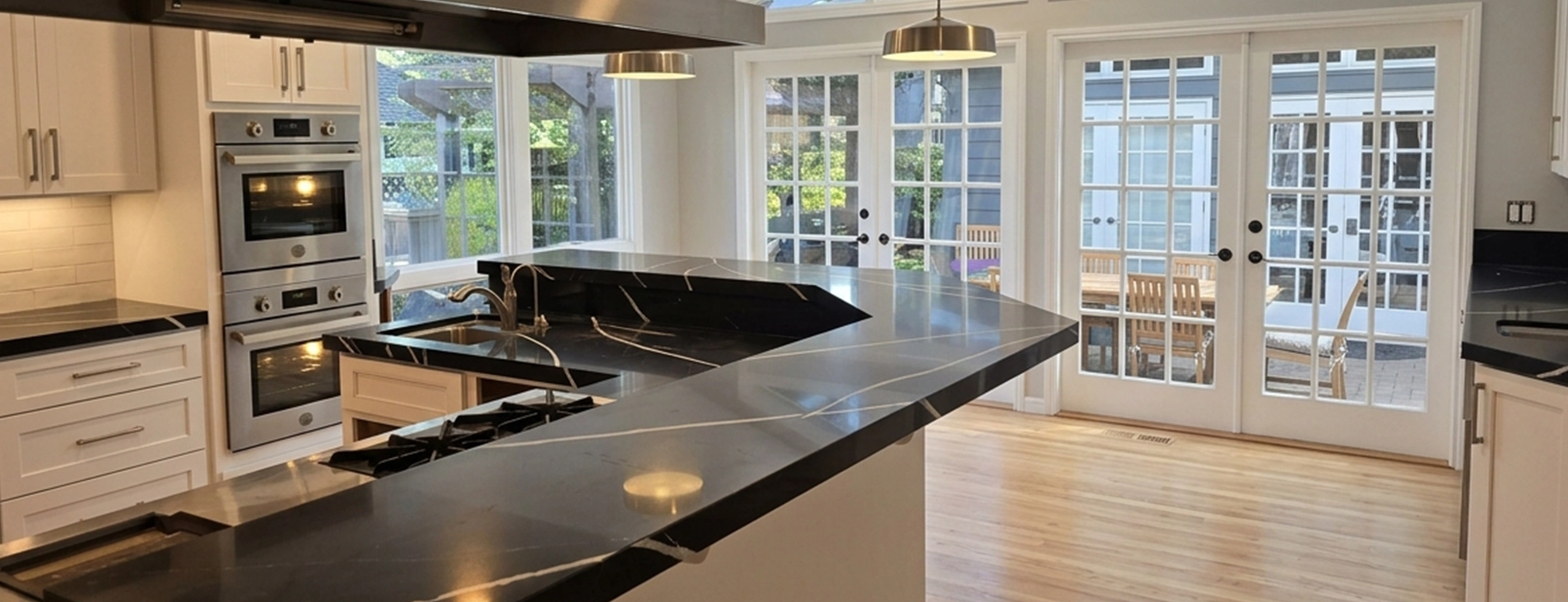 Modern Kitchen with Marble Countertops and French Doors in a Bright Space